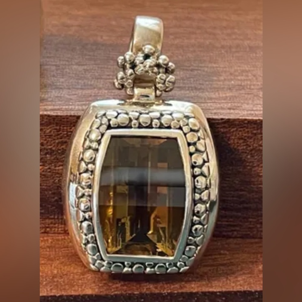 Michael Dawkins pendant / enhancer.
Large smoky quartz and sterling silver